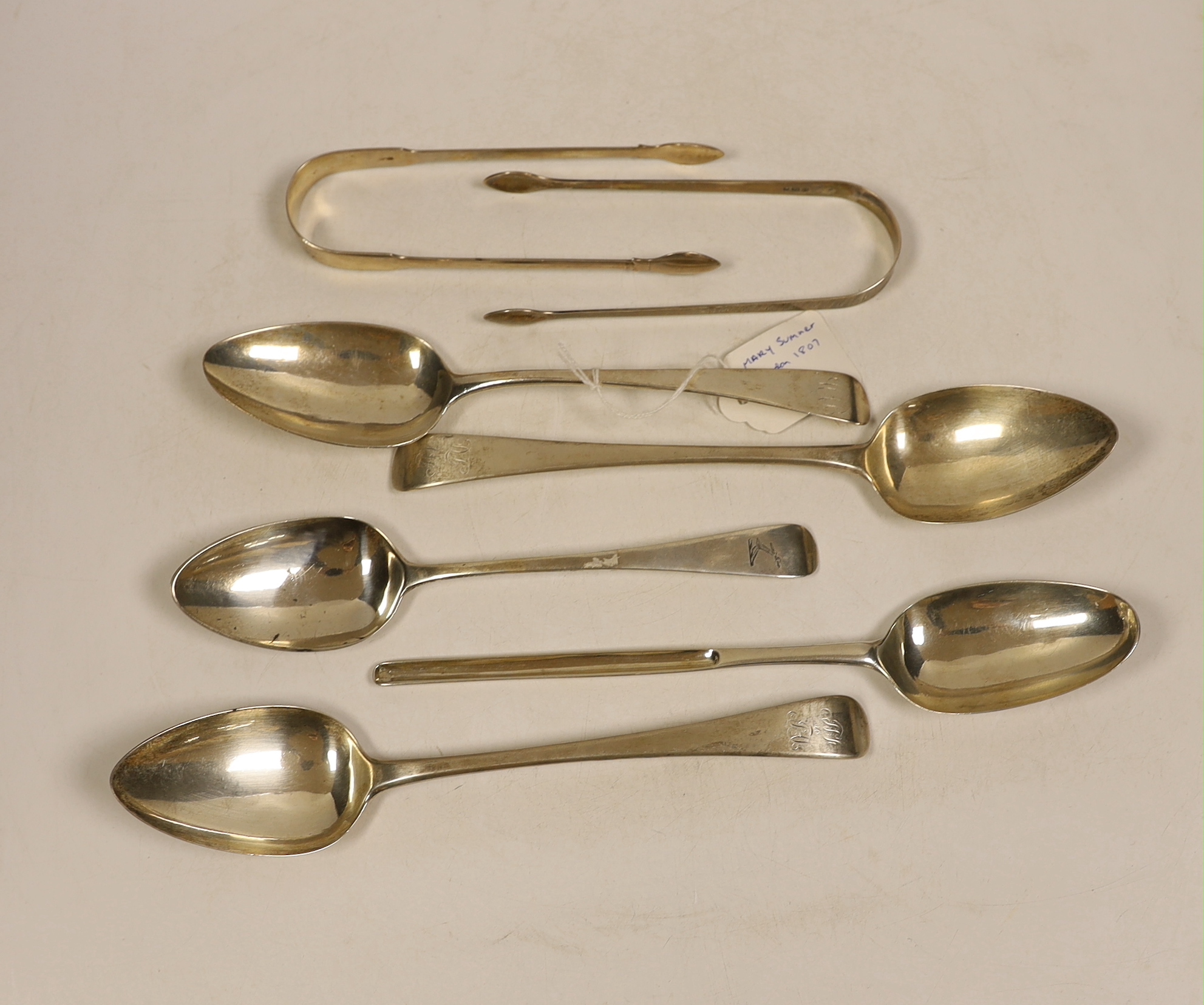 A George II silver marrow scoop spoon, London, 1745?, 24cm, a pair of George III silver Old English pattern table spoons, Peter, Ann & William Bateman, London, 1804, two other George III table spoons and two pairs of Bat